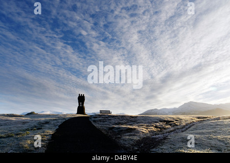 A dramatic winter sunrise with the Commando Memorial at Spean Bridge in the Scottish Highlands Foto Stock