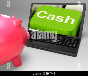 Chiave di cassa su laptop che mostra il risparmio di denaro e di Redditi Foto Stock