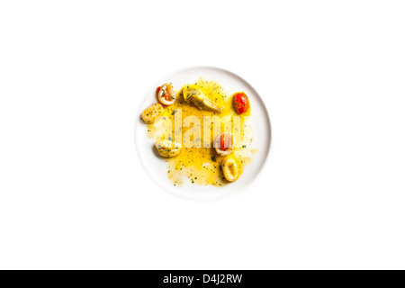 Gnocchi di Patate con Calamari e carciofi - Gnocchi di patate con calamari e carciofi Foto Stock