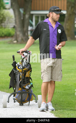 Siamo ski racer Bode Miller passeggiate lungo il campo da golf di Zell am See, Austria, 14 maggio 2009. Bode Miller partecipa al UVEX &Sci Golf Campionati del Mondo 2009 che avvengono in Zell am See dal 14 maggio fino al 17 maggio 2009. Il concorso è composto da un slalom gigante e due round di golf. Foto: Karl-Josef Hildenbrand Foto Stock