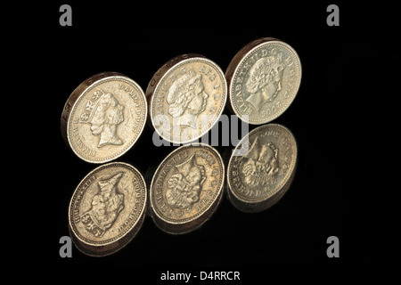 Tre una libbra di monete in una riga Foto Stock
