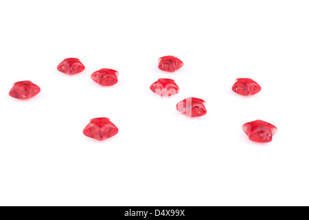 Stelle rosse sparse su sfondo bianco Foto Stock