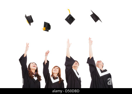 Felice giovani studenti laureati gruppo gettando il hat Foto Stock