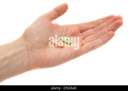 Compresse con plus e il segno meno e mano femmina isolato su bianco. Concetto di scelta. Foto Stock