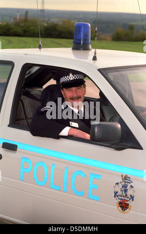 Ex campione del mondo racing driver, Nigel Mansell, in polizia special constable uniforme. Foto Stock