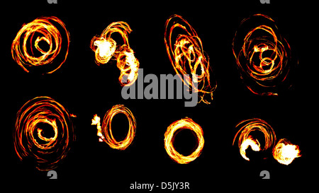 Il fuoco con incandescente linee su sfondo nero, collage Foto Stock