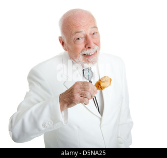 Bello Southern gentleman mangiare delizioso pollo fritto. Isolato su bianco. Foto Stock