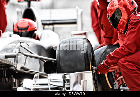 Racing team lavora al pit stop Foto Stock