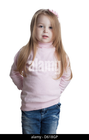 Bambina in maglione e jeans Foto Stock