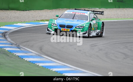 Brasilian BMW race driver Augusto Farfus aziona durante la prima gara del German Touring Car Masters (DTM) al circuito di Hockenheim, in Germania, il 29 aprile 2012. Foto: UWE ANSPACH Foto Stock