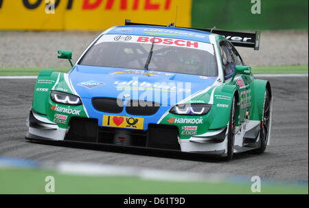 Brasilian BMW race driver Augusto Farfus aziona durante la prima gara del German Touring Car Masters (DTM) al circuito di Hockenheim, in Germania, il 29 aprile 2012. Foto: UWE ANSPACH Foto Stock