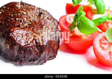 Bistecca con pomodori close up Foto Stock