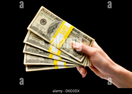hand holding stackf of us currency Foto Stock