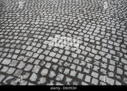 Texture di sfondo del vecchio acciottolato di granito la superficie stradale Foto Stock