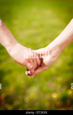 Close-up Holding Hands Foto Stock