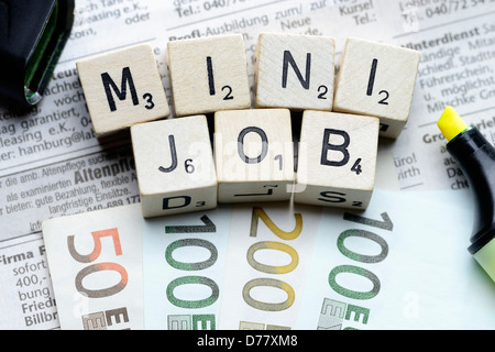 Minijob corsa da cube lettera su annunci pubblicitari sui quotidiani Foto Stock