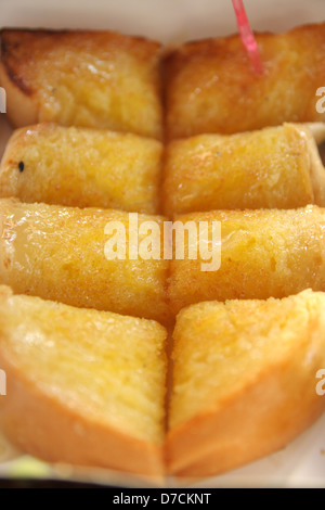 Pane con burro zucchero coperto Foto Stock