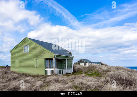 Estate in legno case sulle dune di sabbia a Dunstanburgh, Northumberland, England, Regno Unito Foto Stock