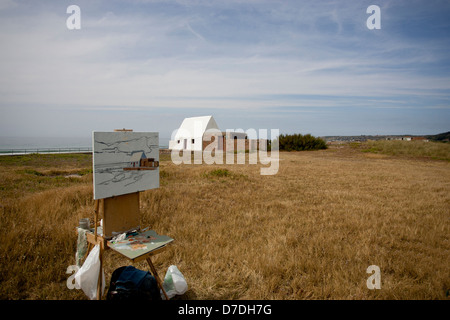 Jersey Le Don Hilton, St Ouen Jersey "Casa bianca" essendo dipinta dal pittore in acqua i colori Foto Stock