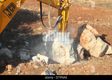 JCB pala di alimentazione facendo lavori di sterro nella Galilea Foto Stock