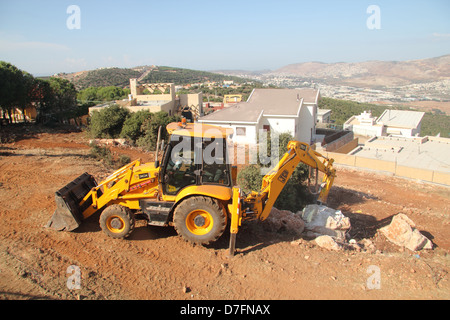JCB pala di alimentazione facendo lavori di sterro in Galilea Kammon Israele Foto Stock