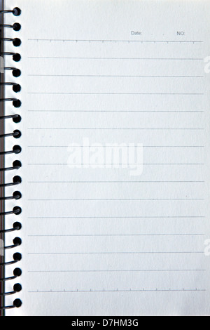 Notebook in appoggio su uno sfondo bianco e il testo scritto sulla copia. Foto Stock