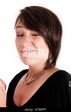 Variazione espressione sul viso di una giovane donna bruna in studio Foto Stock