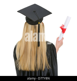 Donna in abito di graduazione con diploma . vista posteriore Foto Stock