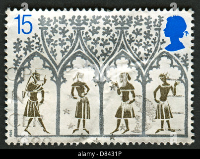 Un timbro stampato nel Regno Unito mostra immagine del XIV secolo di contadini dalla vetrata. Ottocentesimo anniversario della Cattedrale di Ely. Foto Stock