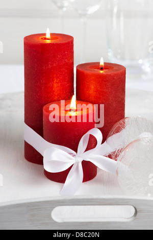 Tre rossi candele accese Foto Stock
