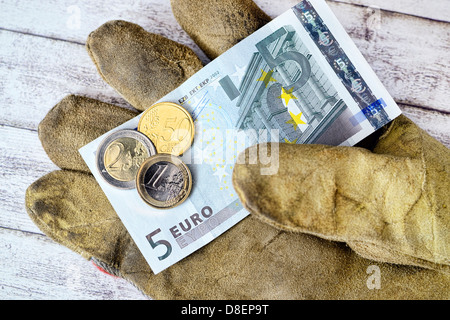 Guanti di lavoro con 8.50 euro salario minimo Foto Stock