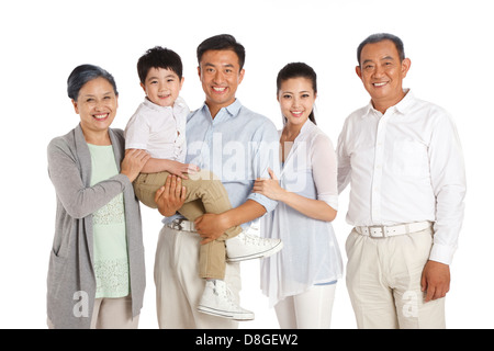 Una famiglia felice e sorriso sul loro famiglia faceWhole Foto Stock