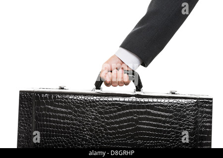 Mano che tiene la valigia Foto Stock