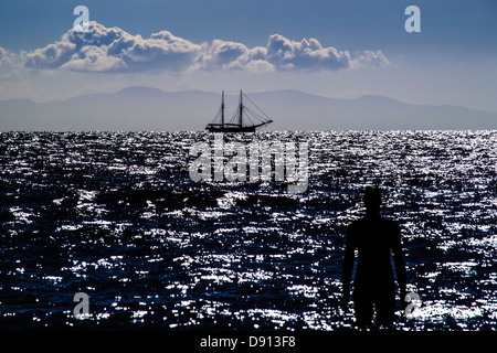 Antony Gormley è un altro luogo in Crosby Foto Stock