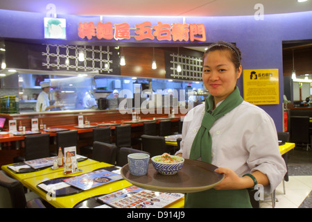 Singapore,Raffles City,shopping shopper shopper shopping shop negozi mercati di mercato acquisti vendita, negozi al dettaglio negozi business business business, centro, restau Foto Stock