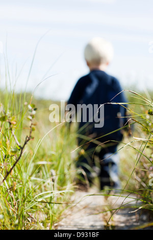 Erba, boy in background Foto Stock