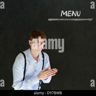 Imprenditore proprietario del ristorante o chef con il menu Chalk segno sfondo blackboard Foto Stock