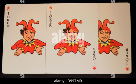 Tre jokers, carte da gioco. Jokers in rosso fuoco su Joker nel mezzo. Foto Stock