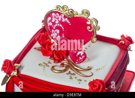 Rosso, bianco e oro iced torta decorata con cuori e rose. Foto Stock