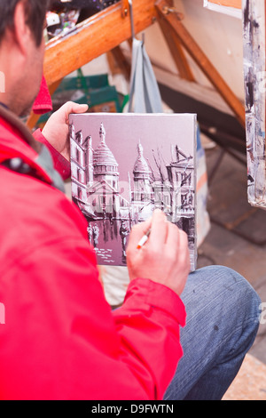 Un artista di strada al lavoro nella famosa Place du Tertre a Montmartre, Paris, Francia Foto Stock