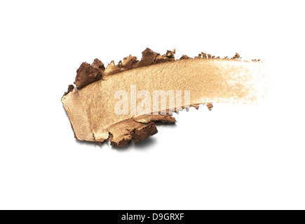 Oro shimmer ombretto cospargere ritagliato su uno sfondo bianco Foto Stock