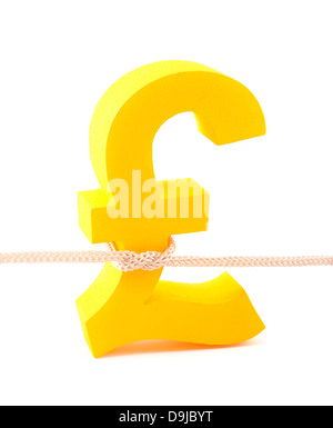 Golden pound simbolo legato con corda Foto Stock