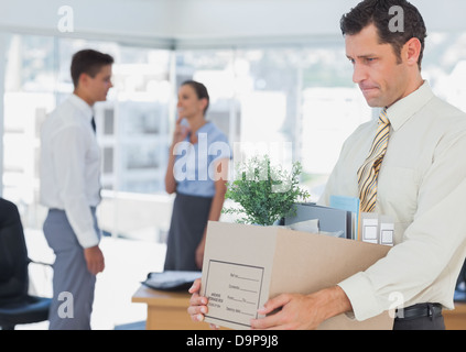 Imprenditore lasciando la carica dopo essere stato cotto Foto Stock