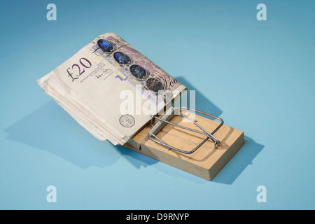 Venti pound note in un mousetrap Foto Stock