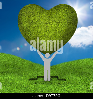 Rappresentazione umana tenendo un grande cuore verde Foto Stock