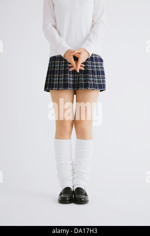 Donna in alta uniforme scolastica Foto Stock