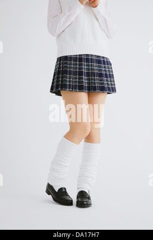 Donna in alta uniforme scolastica Foto Stock