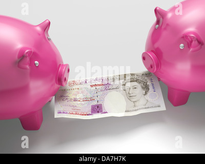 Piggybanks di lotta contro il denaro mostra economia o delle finanze Foto Stock