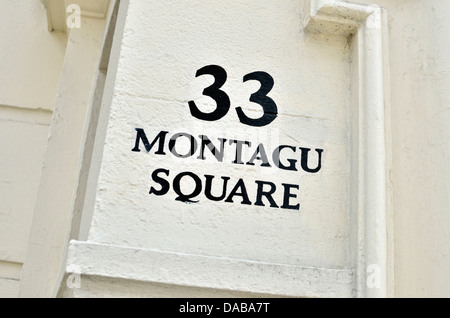 '33 Montagu Square' segno su una parete, Montague Square, Marylebone W1, Londra, Regno Unito. Foto Stock