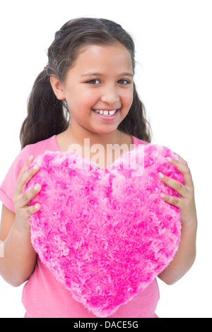 Bambina cuscino di contenimento a forma di cuore Foto Stock